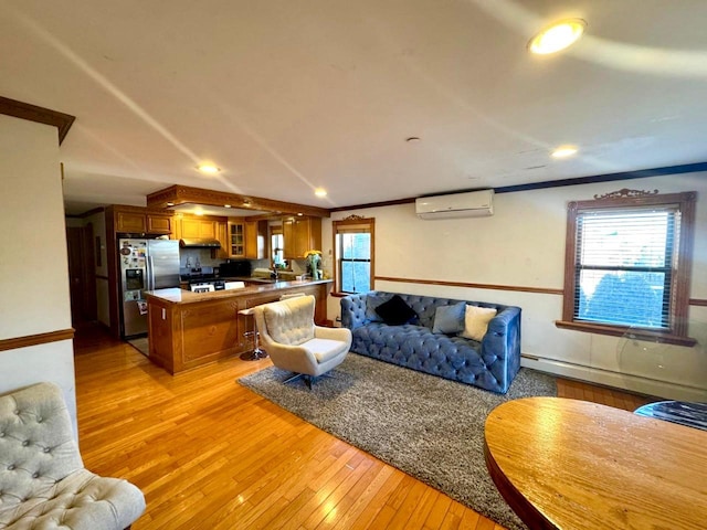 125-19 14th Ave, College Point, NY 11356 - living area featuring a wall unit AC, baseboard heating, light wood-type flooring, plenty of natural light, and recessed lighting