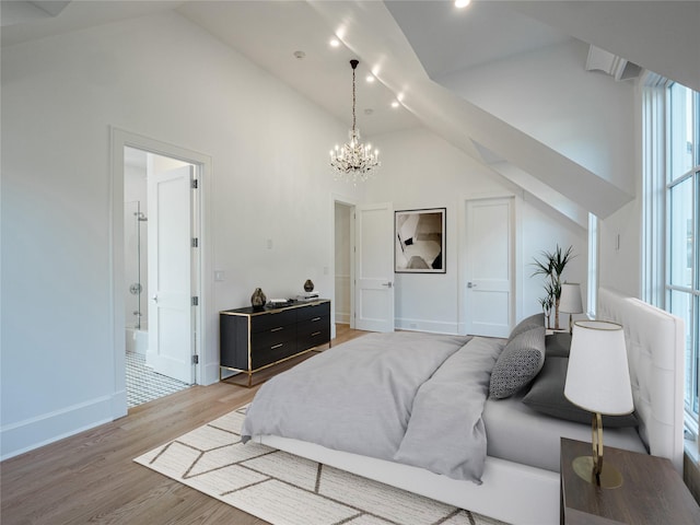 bedroom featuring baseboards, high vaulted ceiling, an inviting chandelier, and light wood-style flooring