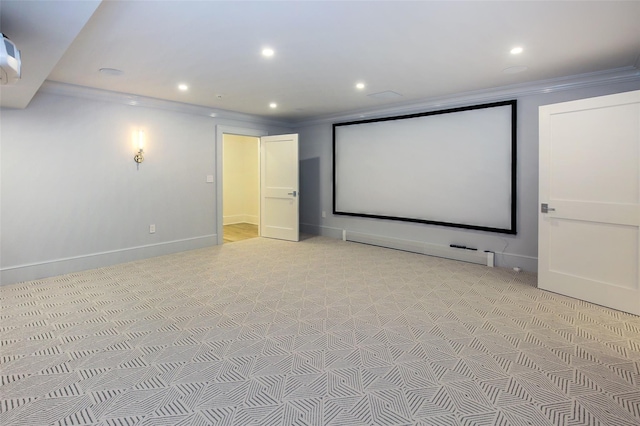 cinema featuring baseboards, recessed lighting, ornamental molding, light colored carpet, and baseboard heating