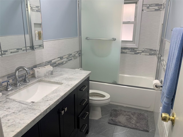 bathroom featuring vanity, shower / bathtub combination, tile walls, toilet, and tile patterned floors