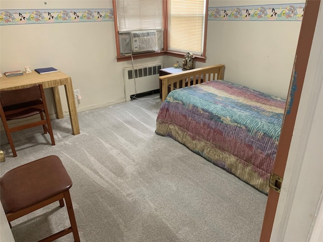 carpeted bedroom featuring radiator heating unit and cooling unit