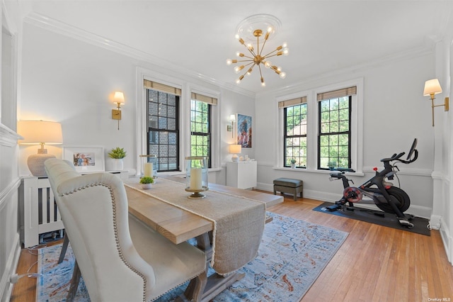 office with hardwood / wood-style floors, a chandelier, baseboards, and ornamental molding