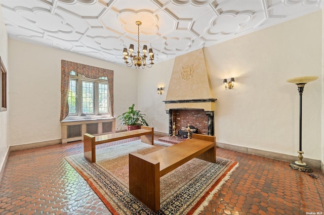 office space with coffered ceiling, radiator heating unit, an inviting chandelier, a fireplace, and baseboards