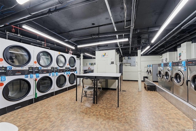 community laundry room featuring stacked washer and dryer and independent washer and dryer