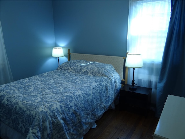 bedroom with wood finished floors