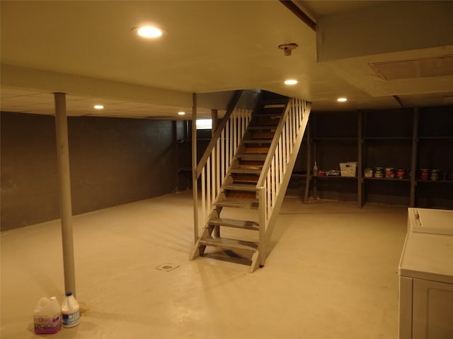 finished below grade area featuring stairs, washer / clothes dryer, and recessed lighting