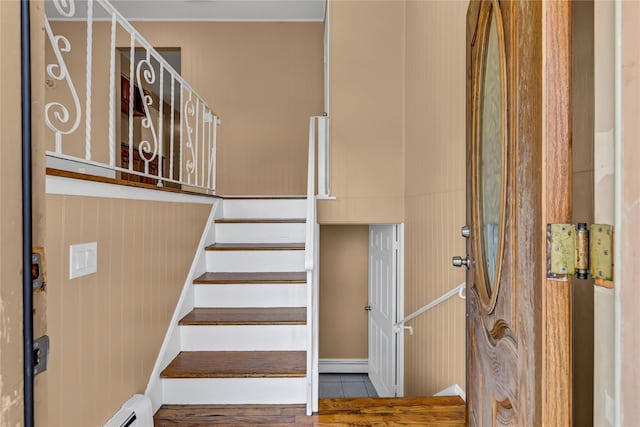 stairway with baseboard heating