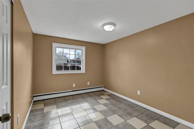 empty room with baseboard heating and baseboards