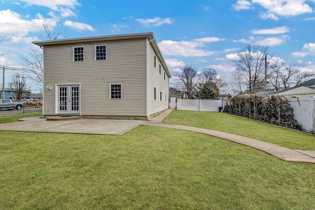 back of house with a patio, a yard, french doors, and fence private yard