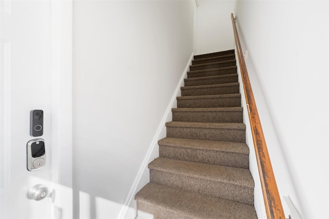 stairway with baseboards