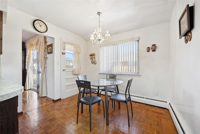 dining area featuring a baseboard heating unit, baseboards, lofted ceiling, baseboard heating, and an inviting chandelier