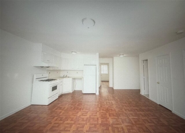 kitchen with white range with gas stovetop