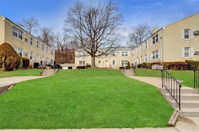 view of property's community featuring a residential view and a lawn