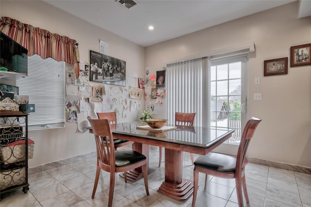 dining area with light tile patterned floors, visible vents, baseboards, and recessed lighting