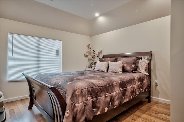 bedroom featuring recessed lighting, baseboards, and wood finished floors