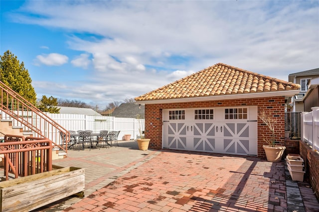 detached garage with fence