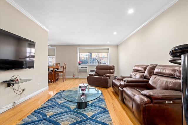 living area featuring recessed lighting, baseboards, crown molding, and light wood-style floors