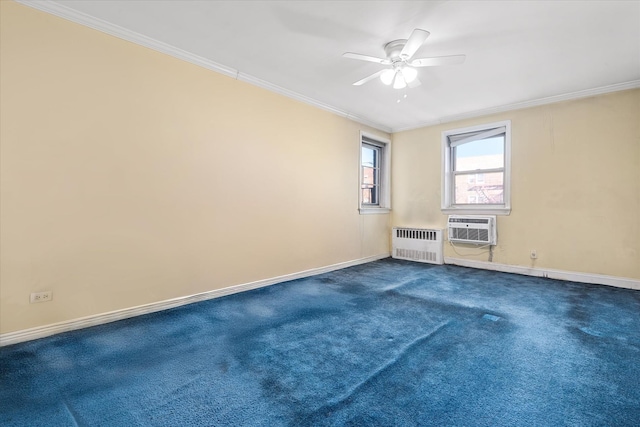 spare room featuring a wall mounted AC, radiator heating unit, baseboards, and ornamental molding