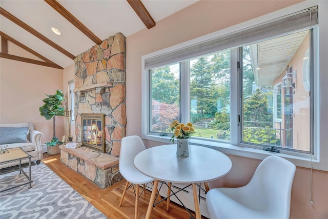 48 Crows Nest Dr, Baiting Hollow, NY 11901 - dining room with plenty of natural light, wood finished floors, and a fireplace
