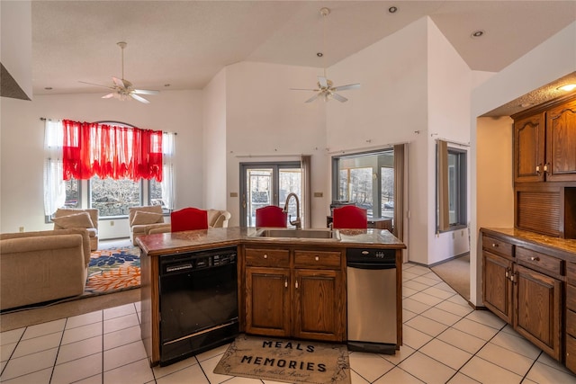 kitchen featuring a ceiling fan, black dishwasher, a sink, and open floor plan