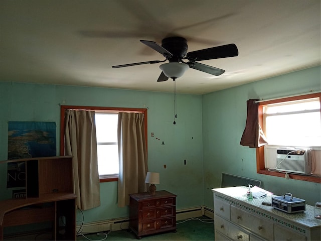 bedroom with cooling unit, multiple windows, baseboard heating, and a baseboard radiator