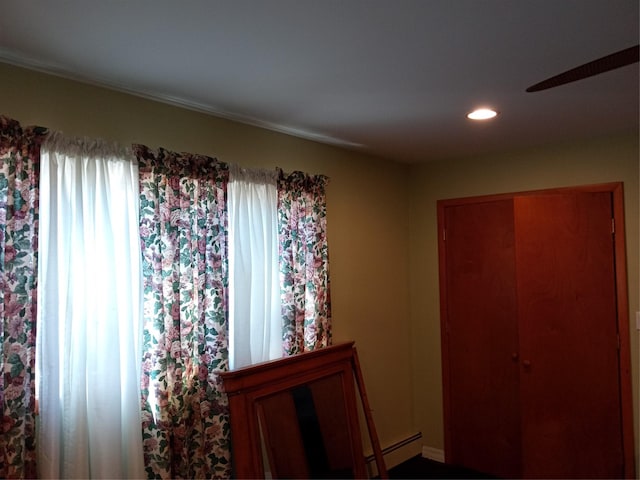 bedroom with recessed lighting and multiple windows