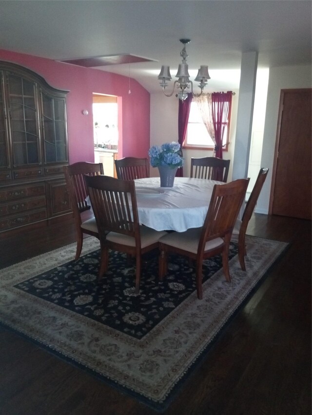 2706 Peconic Ave, Seaford, NY 11783 - dining space featuring a notable chandelier and wood finished floors