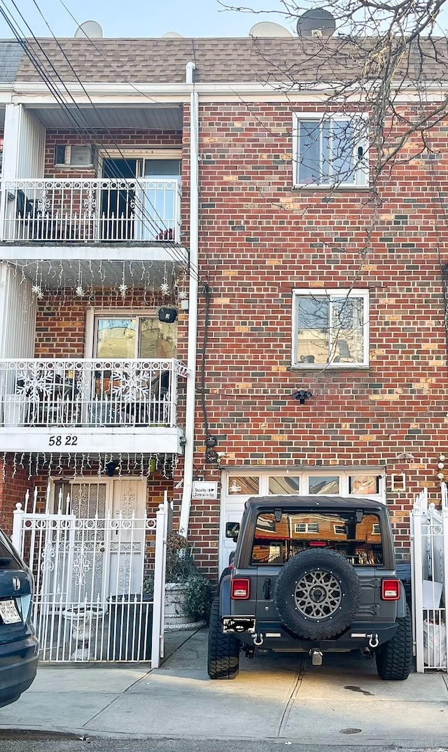 5822 Van Cleef St, Corona, NY 11368 - view of front of home with fence and brick siding