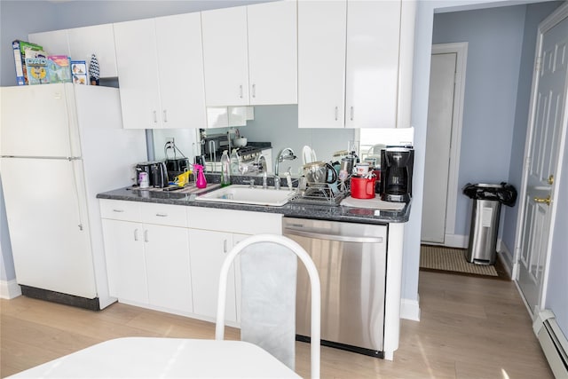 kitchen with light wood finished floors, dishwasher, a baseboard radiator, freestanding refrigerator, and a sink