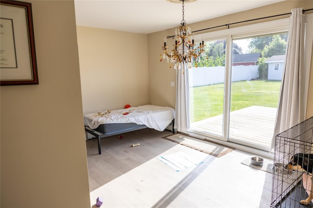 interior space featuring an inviting chandelier and wood finished floors