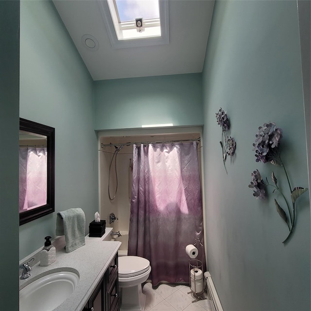 full bathroom with vanity, a skylight, tile patterned floors, toilet, and baseboard heating