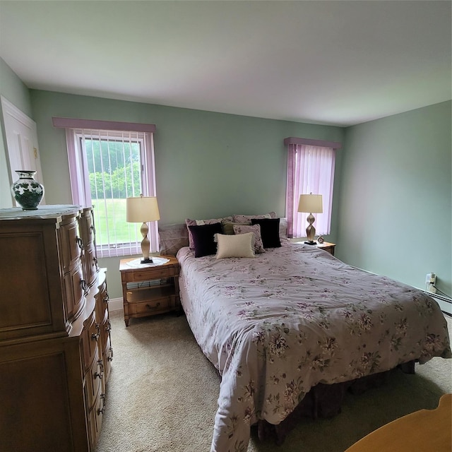 bedroom featuring light carpet