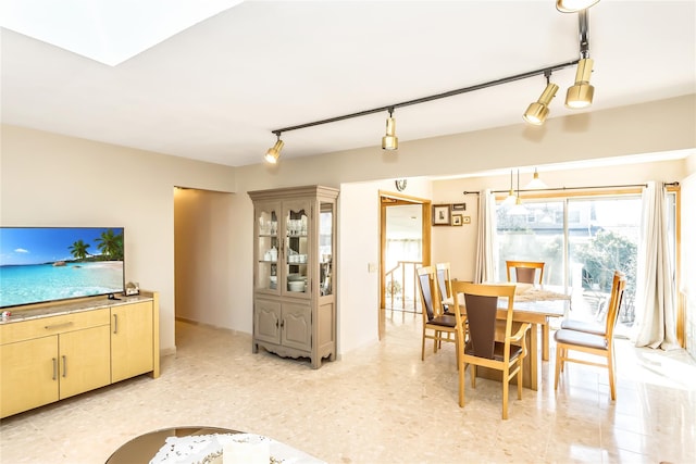 dining space with track lighting