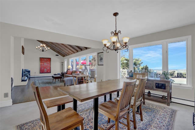dining space featuring a notable chandelier and lofted ceiling