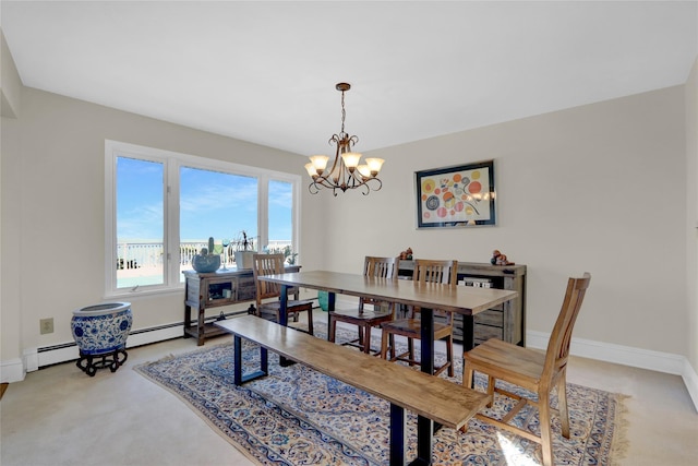 dining space featuring an inviting chandelier, baseboards, and light carpet