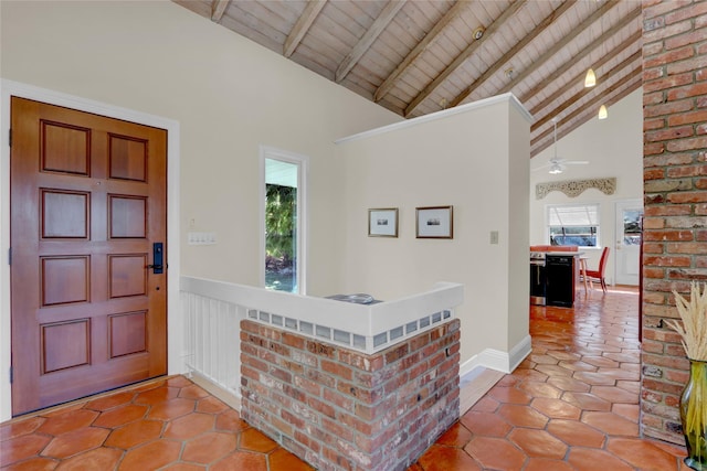 entryway featuring tile patterned flooring, beam ceiling, wood ceiling, and high vaulted ceiling