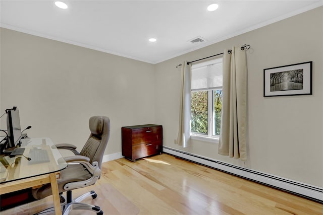 home office featuring visible vents, a baseboard heating unit, ornamental molding, recessed lighting, and light wood-style flooring