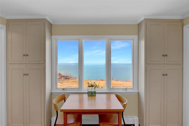 dining space featuring a baseboard heating unit, a water view, and ornamental molding