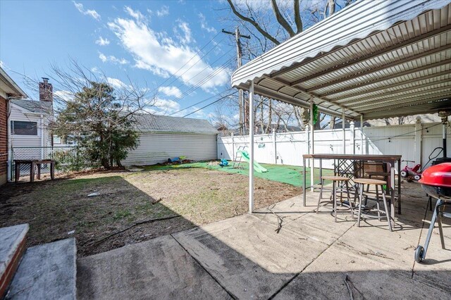 exterior space featuring an outbuilding and a fenced backyard