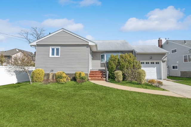 view of front of home with a garage, concrete driveway, a front yard, and fence