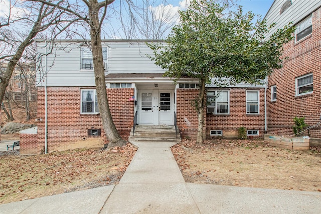 view of front of house featuring brick siding