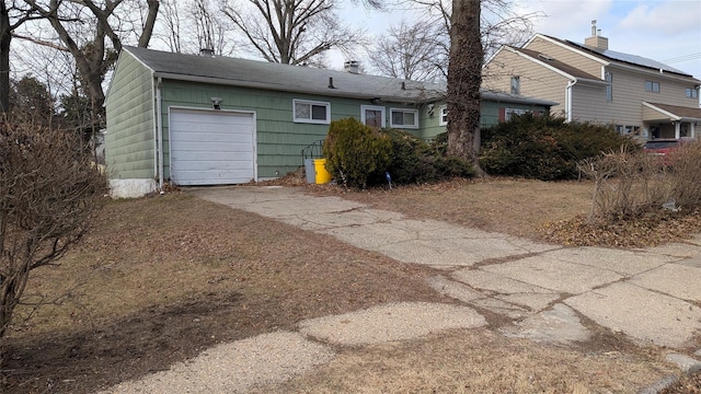 view of front facade featuring an attached garage and concrete driveway