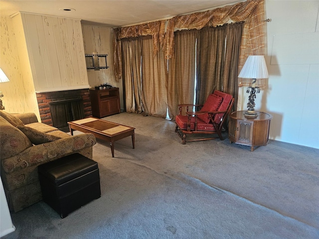 carpeted living room with a brick fireplace