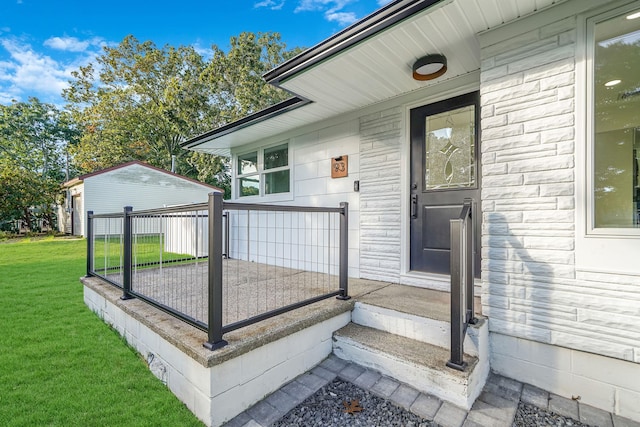 exterior space with a yard and stone siding