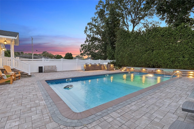 view of pool with a fenced in pool, fence, and a patio area