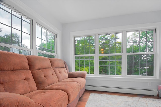 sunroom / solarium featuring baseboard heating