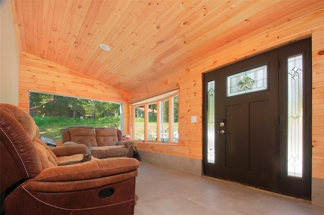 foyer entrance featuring wooden walls, wood ceiling, and lofted ceiling