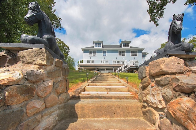 back of property with stairs