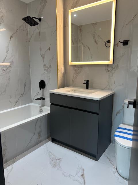108-15 72nd Ave Unit 4D, Forest Hills, NY 11375 - full bath featuring shower / washtub combination, vanity, toilet, and marble finish floor