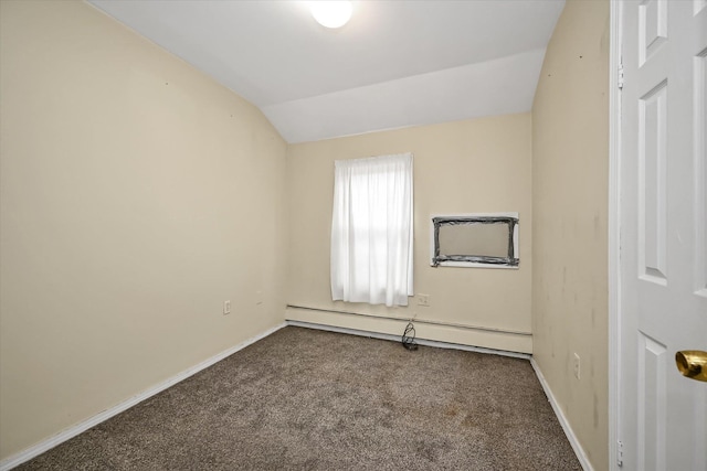 unfurnished room featuring vaulted ceiling, carpet, baseboards, and a baseboard radiator